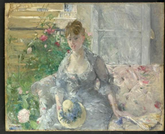 Young Woman Seated On A Sofa