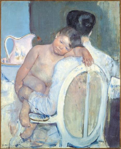 Woman Sitting With A Child In Her Arms