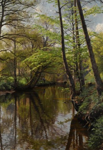 Spring day in the woods. A man is fishing in a stream